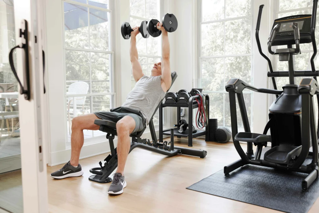 MXR23_LIFESTYLE_BENCH male dumbbell-incline chest press_side-angle_lores